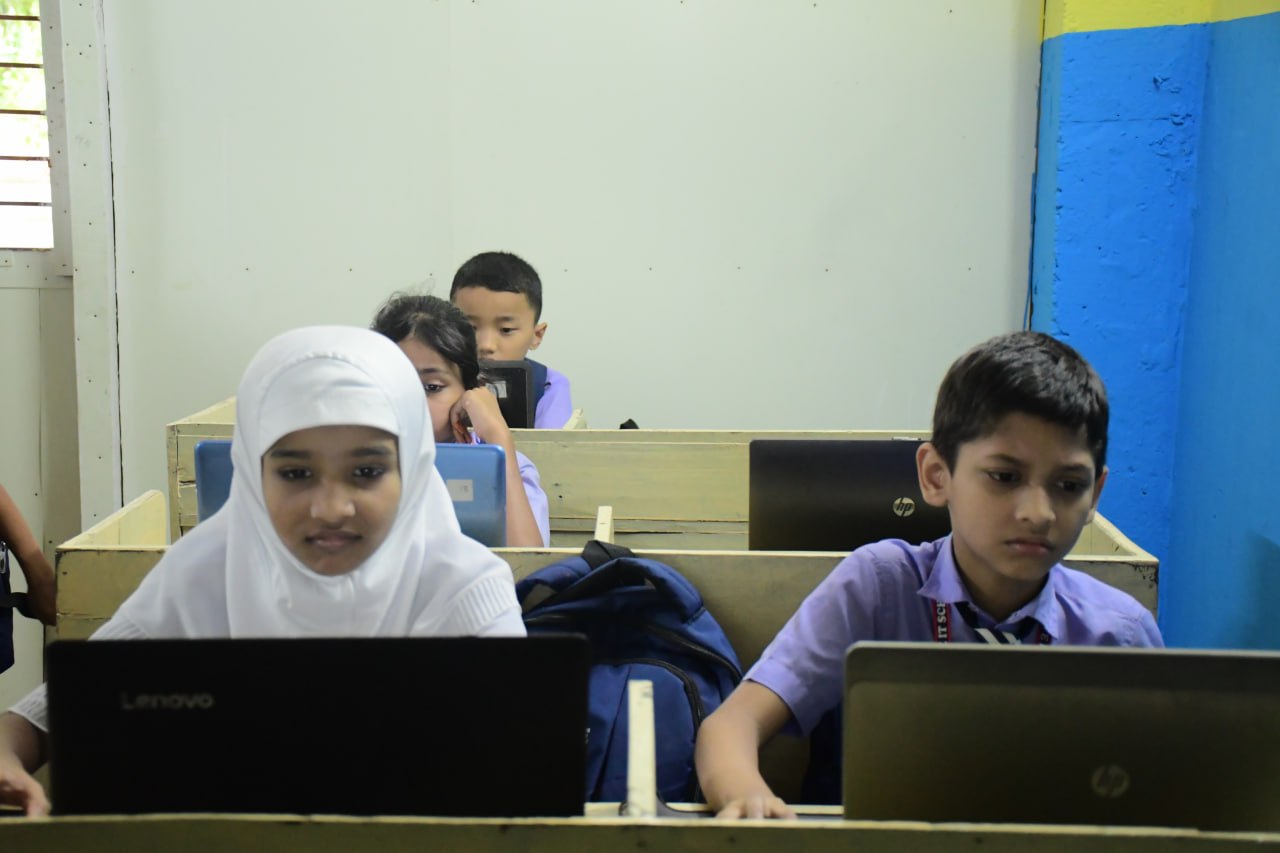 A child working calmly at a desk at home
